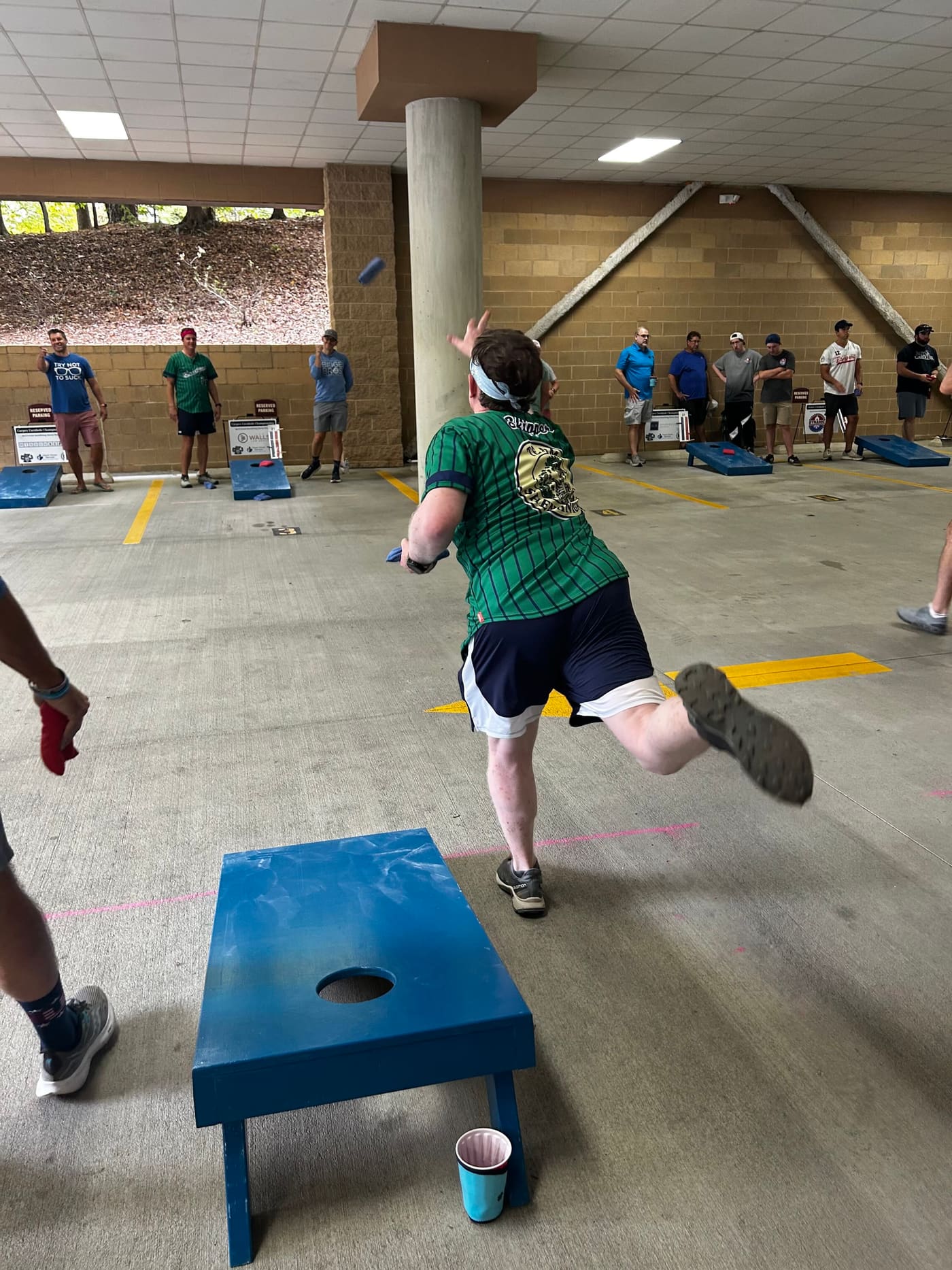 A player mid-toss at the 2025 Carpex Cornhole Championship